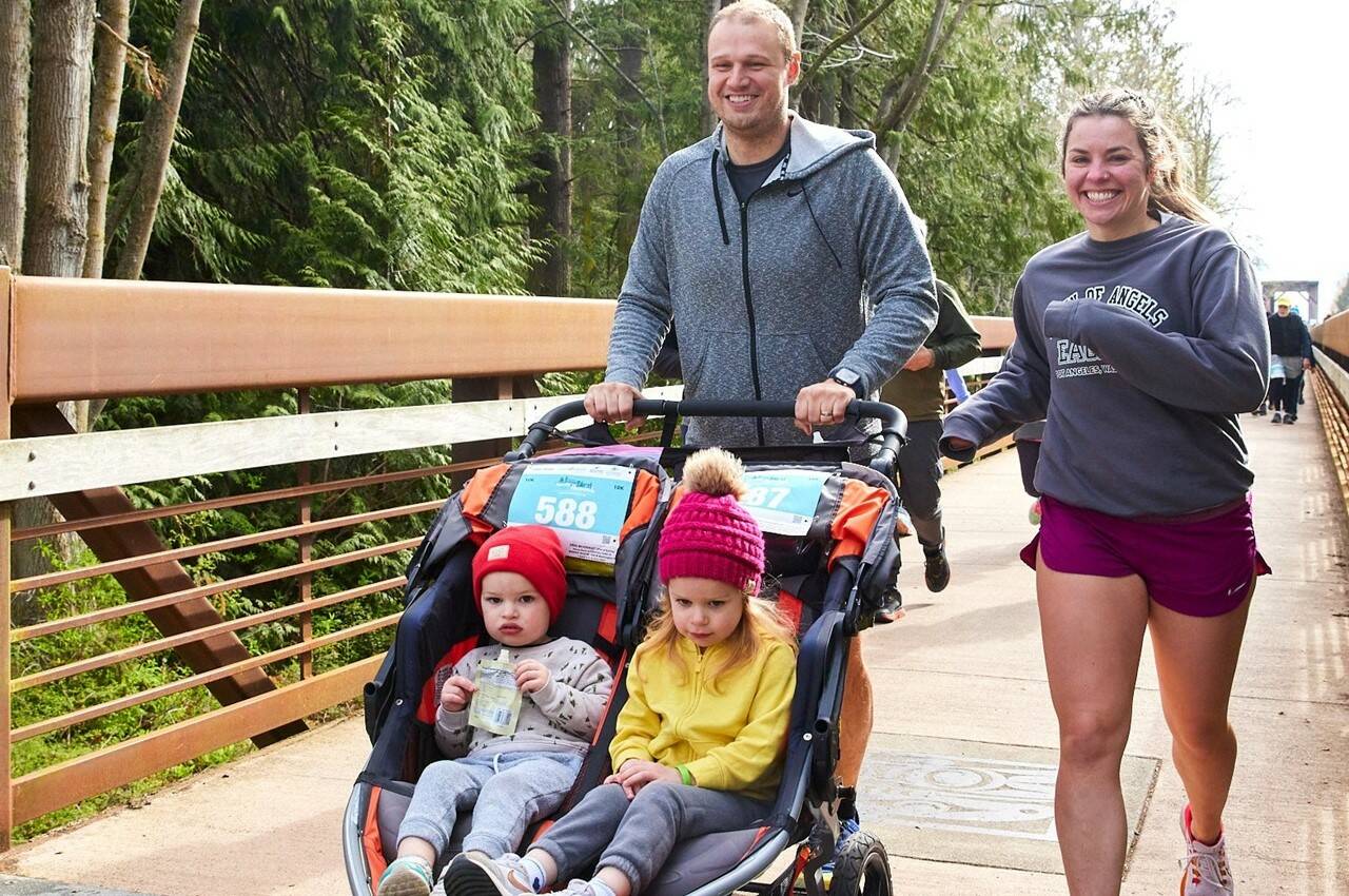 Jeremy and Jessie Gilchrist of Port Angeles take off in the 2023 edition of the Sequim Railroad Bridge Run, part of the Run the Peninsula series. (Matt Sagen/Cascadia Films)