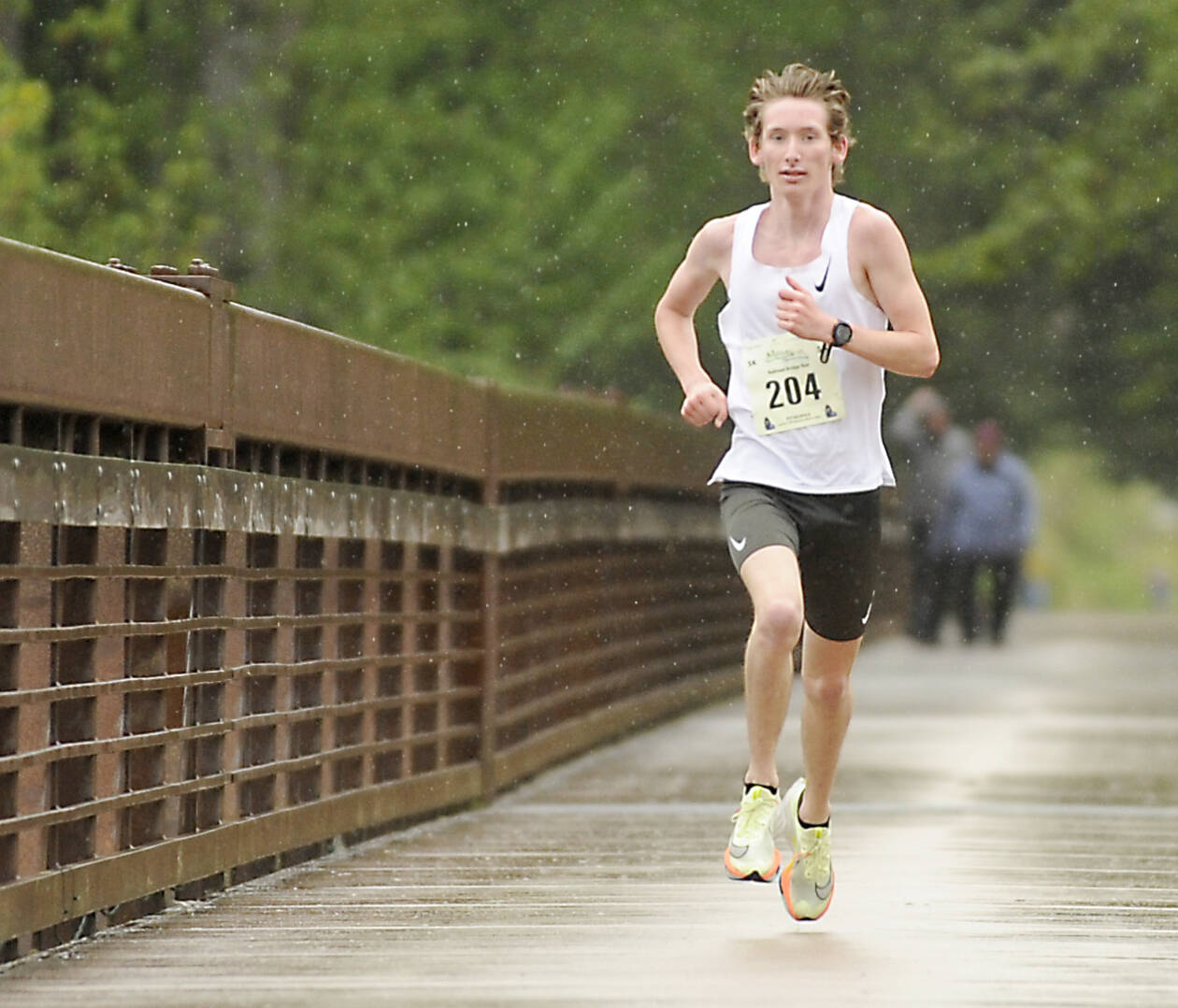 Men’s 5K winner Langdon Larson of Port Angeles reaches the finish line at the Sequim Railroad Bridge Run. Larson won the 5K by nearly two minutes. (Michael Dashiell/Olympic Peninsula News Group)