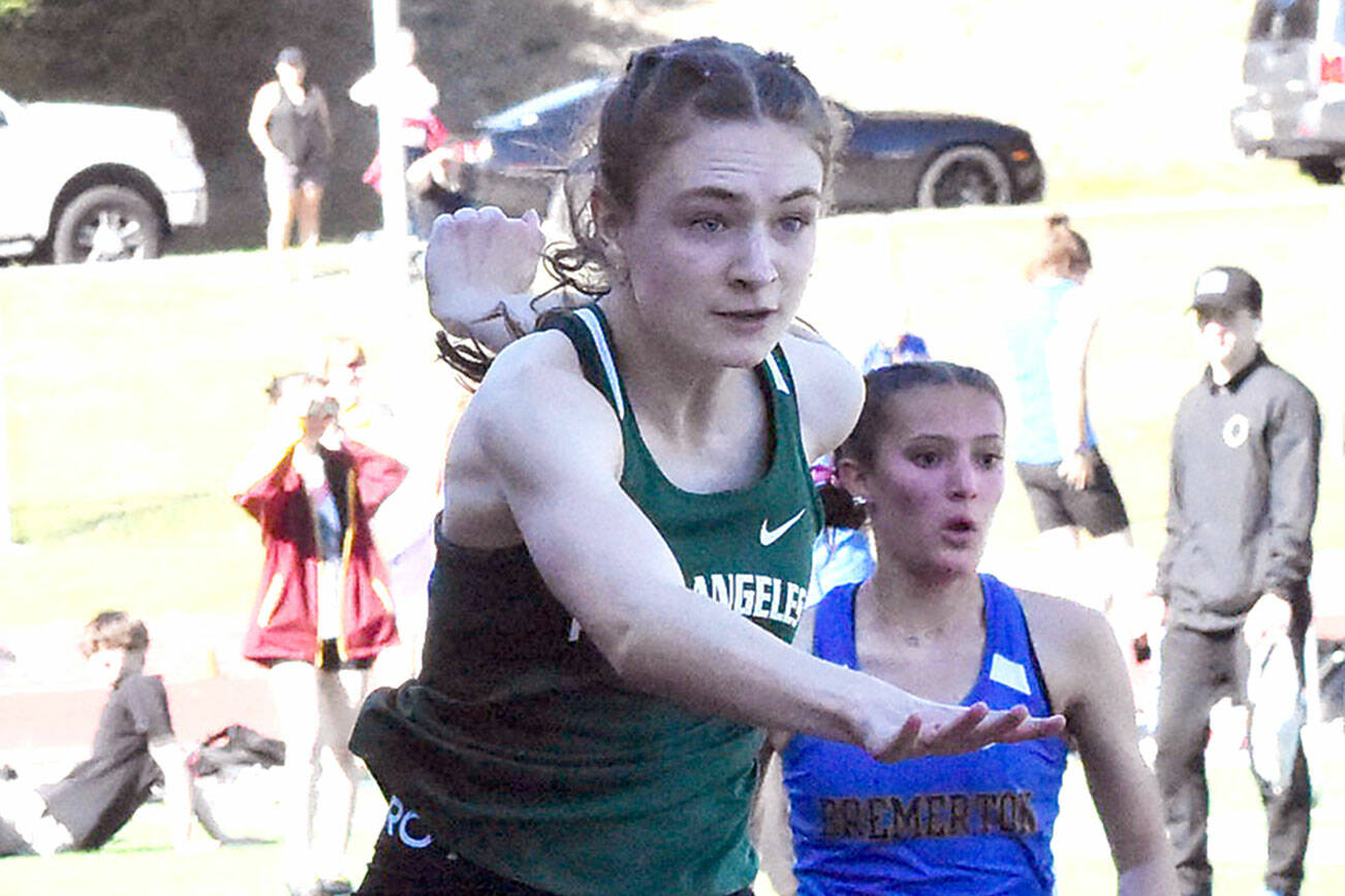 Nicholas Zellar-Singh/Kitsap News Group
Port Angeles' Faerin Tait leaps during the 100-meter hurdles Thursday at the Olympic League Track and Field Championship at North Kitsap High School.