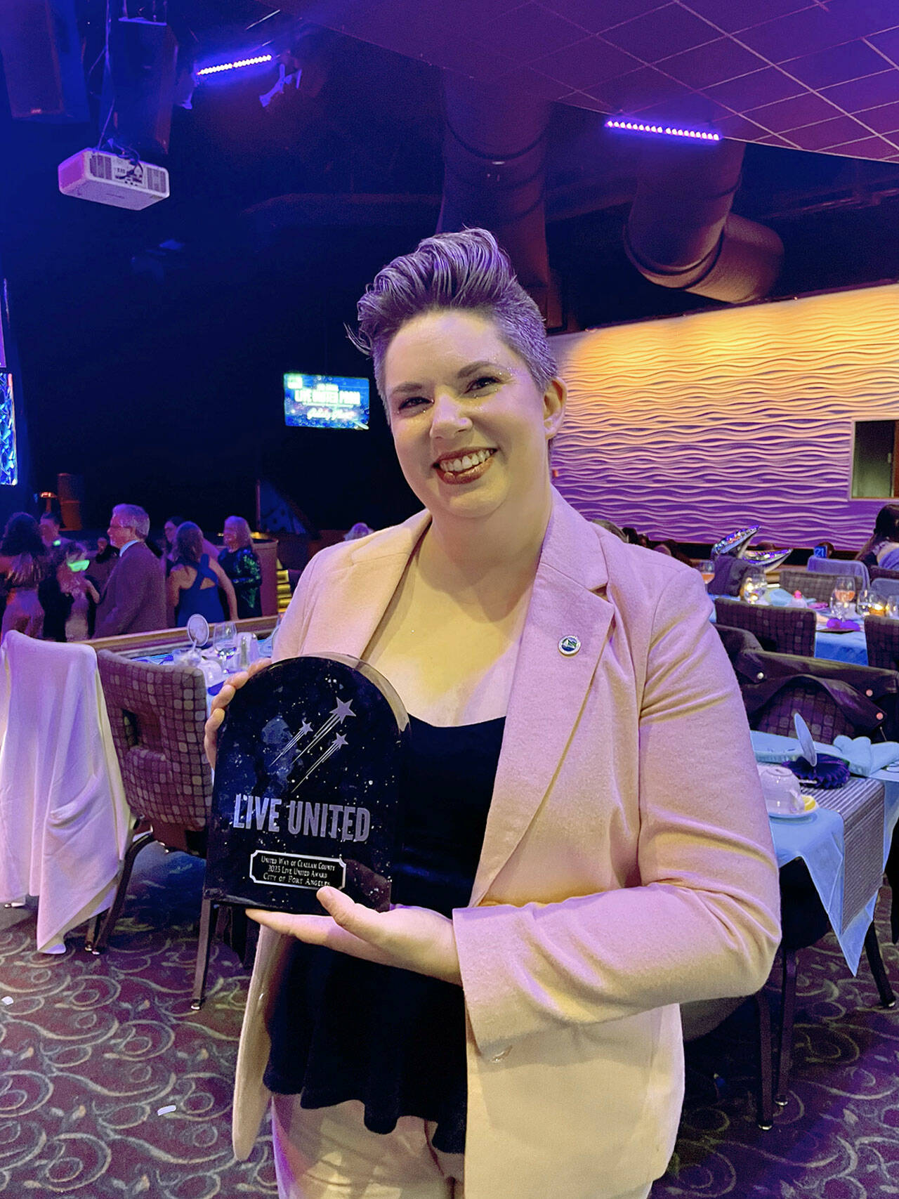 Deputy Mayor Navarra Carr accepts a Live United Award on behalf of the city of Port Angeles.