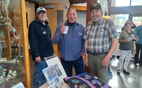 Sarge’s Veteran Support house managers, from left, Danny Deckert, David Durnford and Steve Elmelund welcome attendees to the organization’s first fundraiser at the Dungeness River Nature Center on April 27. The event raised nearly $50,000. (Sarge’s Veteran Support)