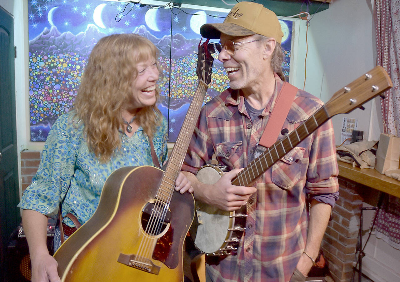 Kim Trenerry, left, and Jason Mogi, who make up the Port Angeles-based duo Deadwood Revival, shown Tuesday at the New Moon Craft Tavern in Port Angeles, will perform at this weekend’s Juan de Fuca Festival of the Arts. (Keith Thorpe/Peninsula Daily News)