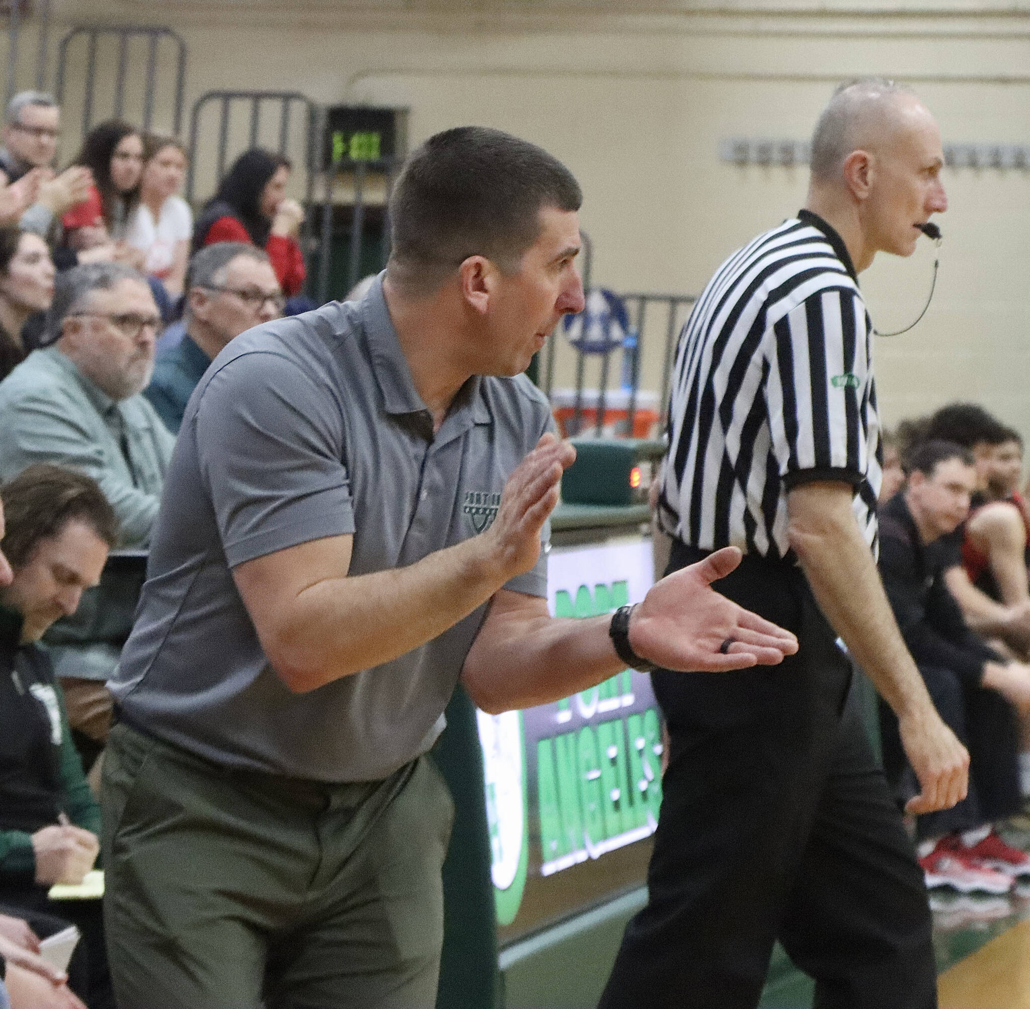 Dave Logan/for Peninsula Daily News
Port Angeles head coach Kasey Ulin urges his team on from the bench during a contest last season. Ulin will be honored with the Pat Fitterer “You Gotta Love It” Positive Coach Contributor Award from the Washington Interscholastic Basketball Coaches Association during a ceremony July 17 in Longview.