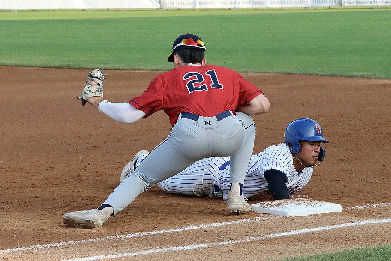 Lefties Roberto Nunez III returns safely to first base last summer at Civic Field in Port Angeles. Nunez, who hit .330 for Port Angeles last season, will return this year along with 9 other players. (Dave Logan/for Peninsula Daily News)