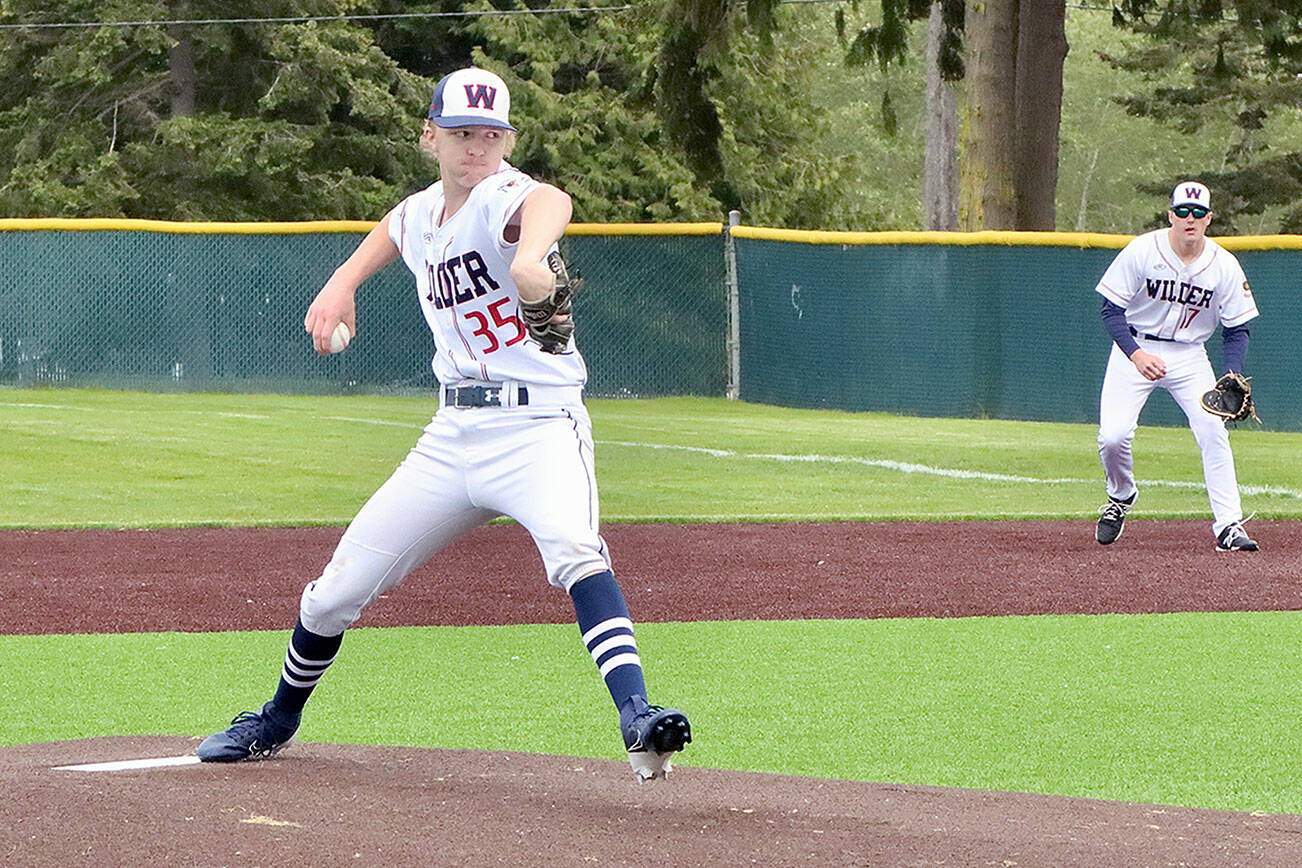 Wilder Senior pitcher Landen Olson of Forks is backed up by his first baseman Brayden White of Sequim as he pitches in the first inning of Wilder's game with Narrows U18 out of Gig Harbor. Narrows won 7-6. (Dave Logan/for Peninsula Daily News)