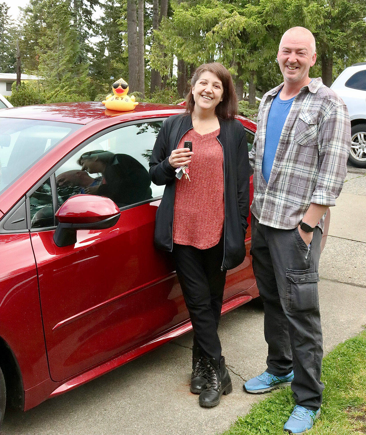 John and Sarah Aten of Port Angeles won the 2024 Toyota Corolla donated by Wilder Auto in the 35th Great Olympic Peninsula Duck Pluck. Sarah said she will mostly drive it. The family buys a package for $350 every year, including one entry in the VID race and 60 entries in the main race. Their VID duck is labeled JETS, which stands for the four members of their family — John, teenagers Elora and Tim as well as Sarah.
