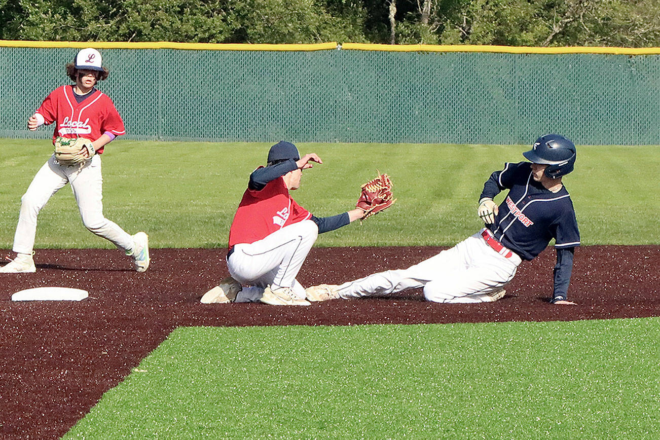 Garret Buerer of the Westport team tries to steal second base on Tuesday night in the Olympic Junior Babe Ruth semifinal, but is put out by Local 155's Ethan Barbee as he slides. Local 155 second baseman Brayden Scott backs up the play. Westport won 4-0 to qualify for the championship game at 5:30 p.m. Tuesday at Volunteer Park, against the winner of Athlete's Choice and First Federal. (Dave Logan/for Peninsula Daily News)