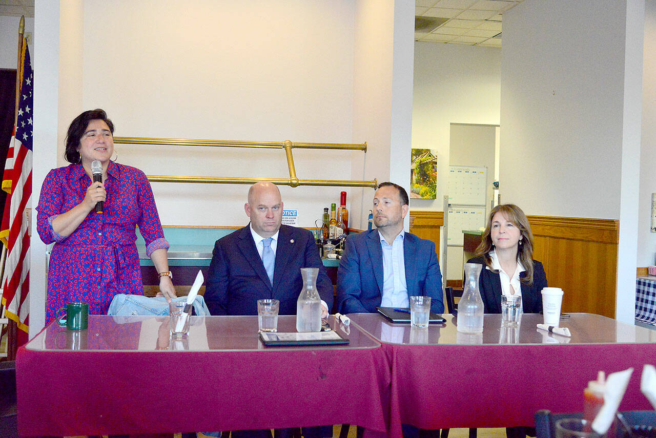 From left to right, State Sen. Emily Randall, D-Bremerton, state Sen. Drew MacEwen, R-Union, Port Angeles attorney Graham Ralston and Commissioner of Public Lands Hilary Franz, all candidates for Washington’s 6th Congressional District, appear before the Port Angeles Business Association on Tuesday to answer questions about their priorities for serving in Congress. (Peter Segall/Peninsula Daily News)