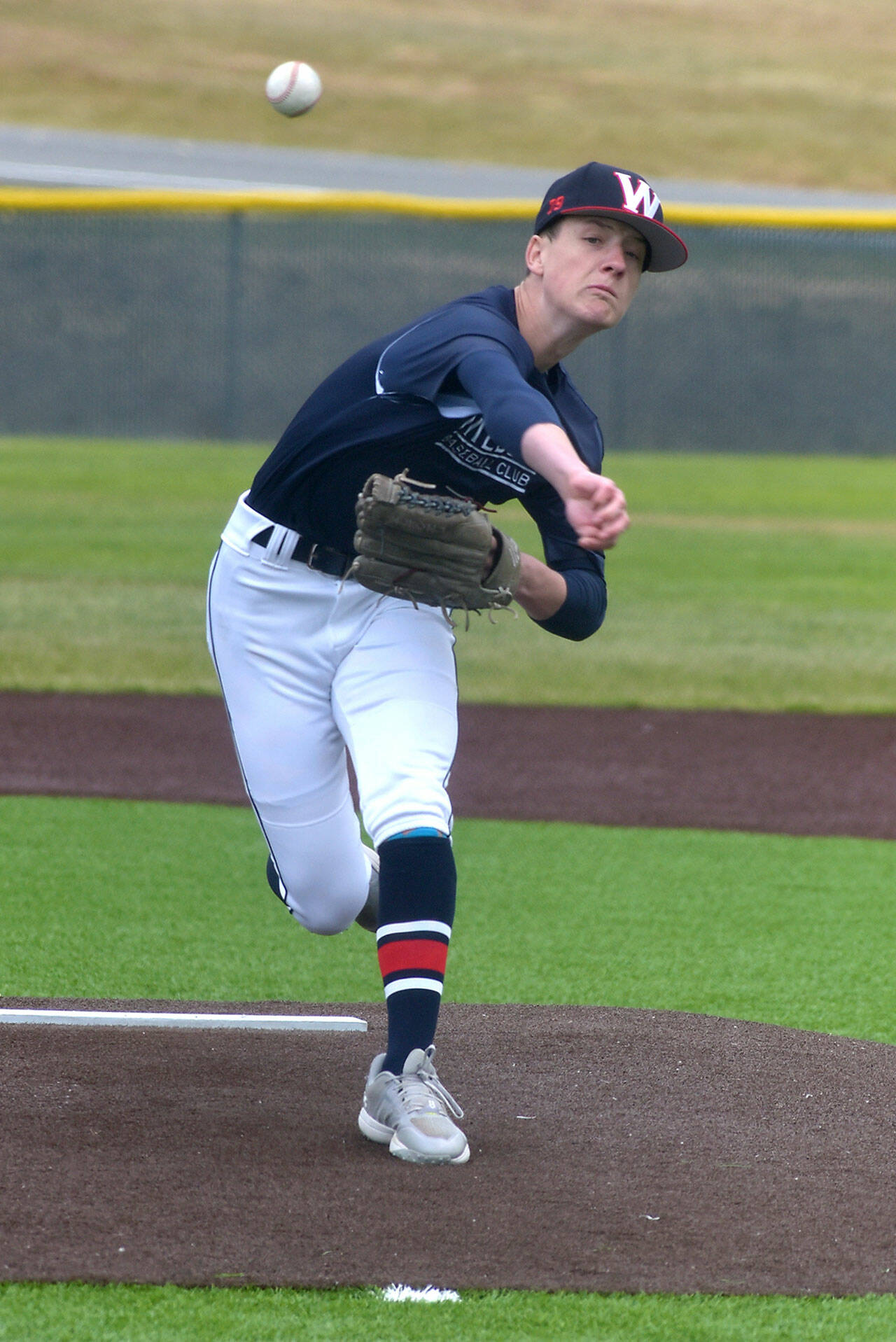 KEITH THORPE/PENINSULA DAILY NEWS Wilder A pitcher Ethan Swenson pitches against the Maple Ridge, B.C. Royals on Saturday at Volunteer Field in Port Angeles.