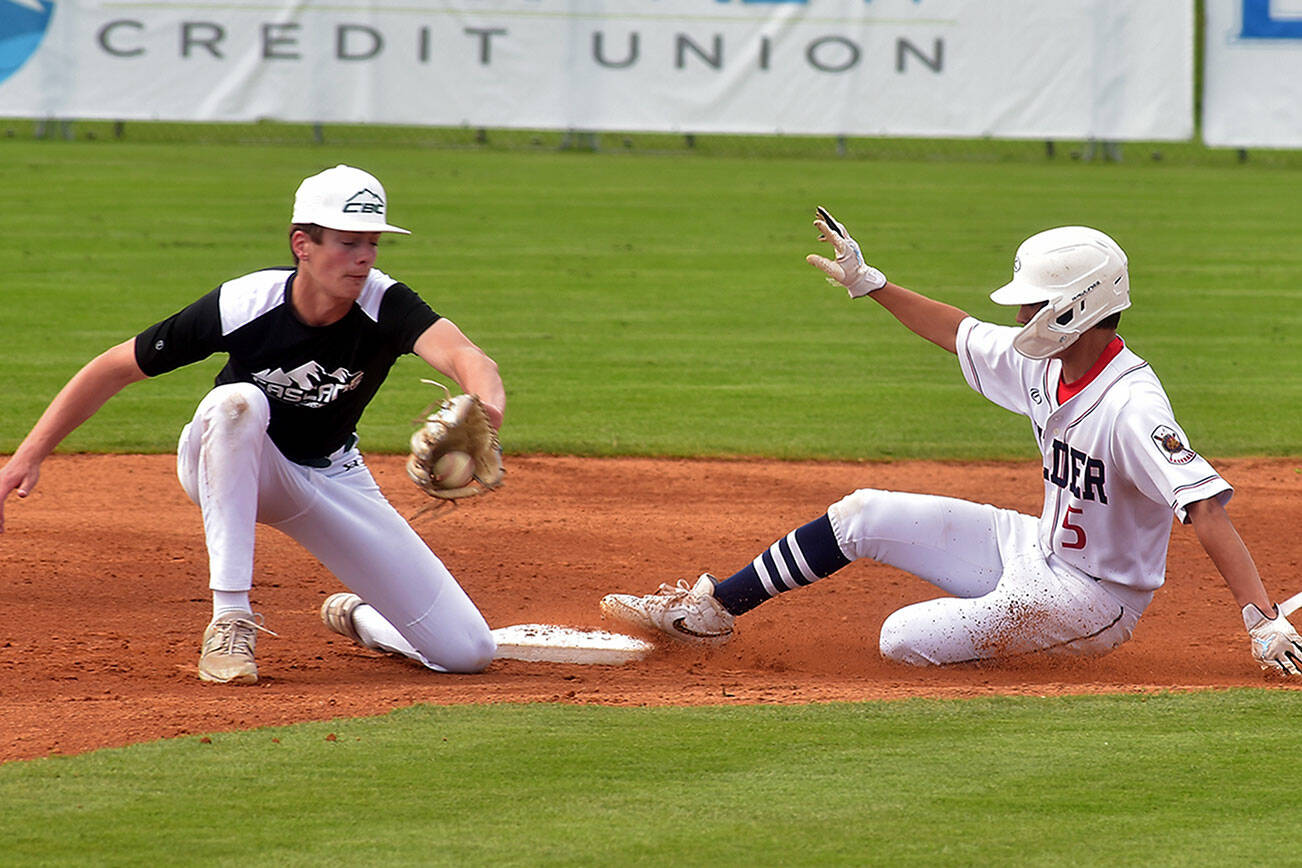 KEITH THORPE/PENINSULA DAILY NEWS
Wilder Senior's Alex Angevine, right, makes it to second ahead of the throw to Crush Orange's Sam Kok on Saturday morning at Port Angeles Civic Field.