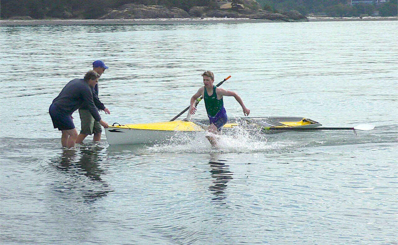 Cooper Disque of the Olympic Peninsula Rowing Association leaves his boat in the Western Canadian Beach Sprint Championship held last weekend. (Olympic Peninsula Rowing Association)