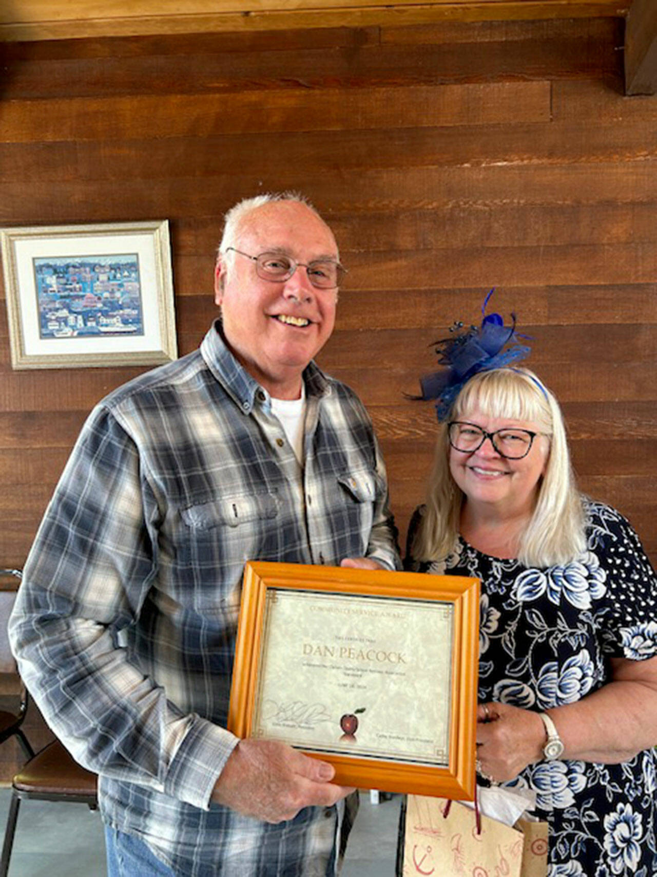Dan Peacock, on left, receives the 2024 Community Service Award from Lora Brabant, president of the Clallam County School Retirees Association.
Dan Peacock, on left, receives the 2024 Community Service Award from Lora Brabant, president of the Clallam County School Retirees Association.