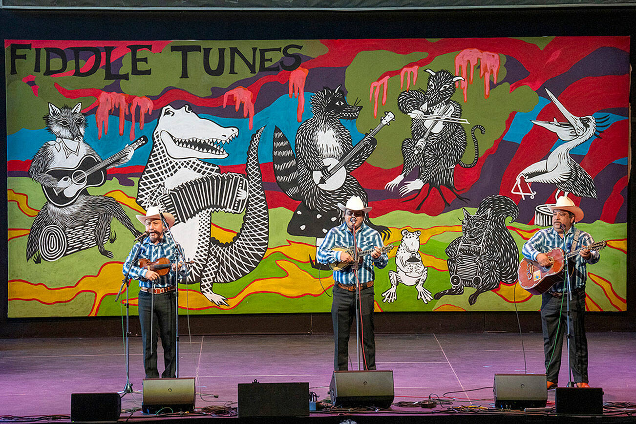 A trio, Canto a Mi Tierra of Veracruz, Mexico, with Osiris Ramses Caballero Leon, left, Bernabe Hernandez Orozco, center, and Fernando Hernandez Orozco, play a set of traditional Mexican music originating in the six states of northeastern Mexico in McCurdy Pavilion on Saturday in one of the final concerts to close out the week of Fiddle Tunes presented by Centrum at Fort Worden. (Steve Mullensky/for Peninsula Daily News)