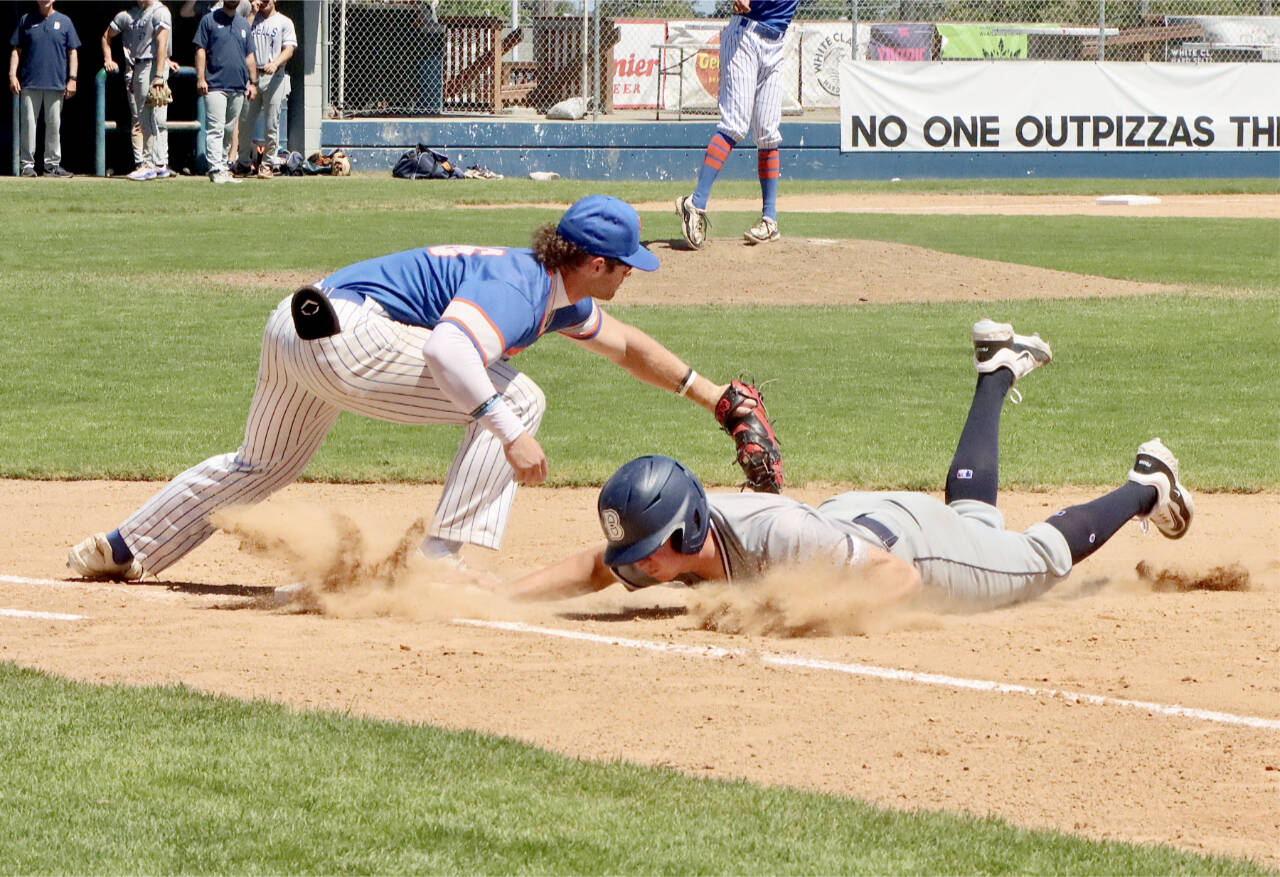 Jeremy Giesegh of the Port Angeles Lefties, playing first base, tags a Bellingham runner during a pickoff attempt Sunday at Civic Field. Giesegh, who is batting .373, was selected to the North team for the West Coast League’s first All-Star game since 2019. The game will be played in Bellingham. (Dave Logan/for Peninsula Daily News)