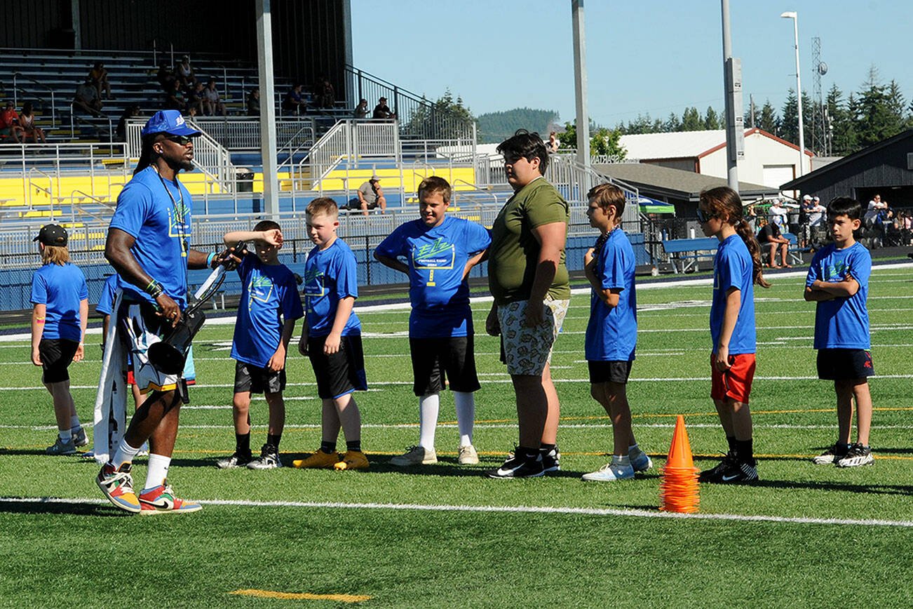 Lonnie Archibald/for Peninsula Daily News
Former Seattle Seahawks special teams captain and current coach Neiko Thorpe instructs athletes during a football camp held recently at Spartan Stadium. Some 68 participants from Forks, Neah Bay, Hoquiam and Montesano turned out for the camp. Thorpe is married to Forks native Maegan Leppell.