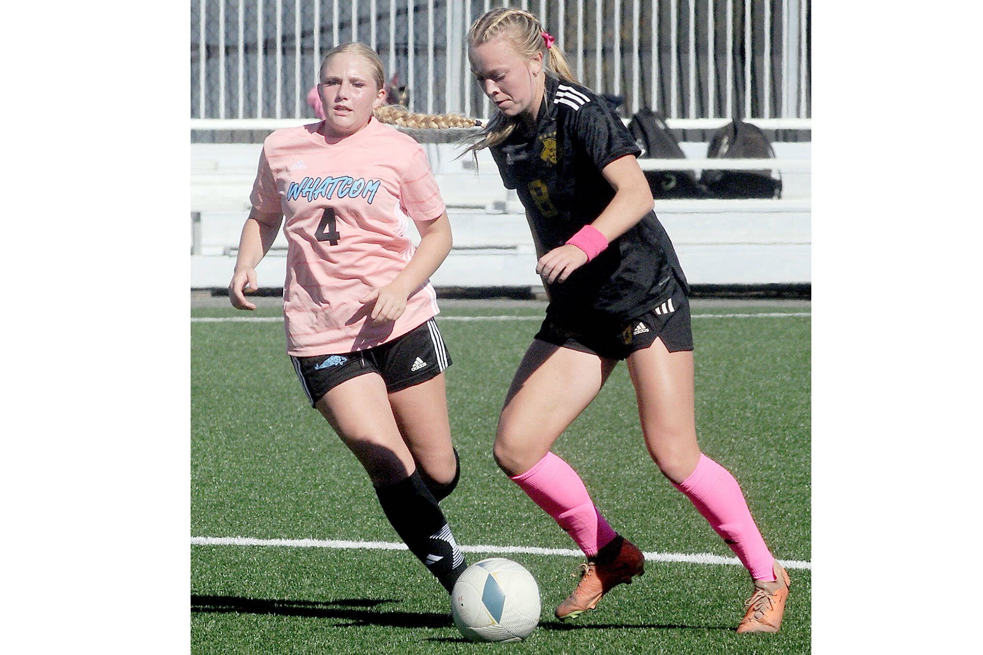 Peninsula’s Anna Petty, right, advances the ball past Whatcom’s Tori Oord during a match last year at Wally Sigmar Field in Port Angeles. Petty, who scored 12 goals last year, is back for the Pirates this season. (Keith Thorpe/Peninsula Daily News)