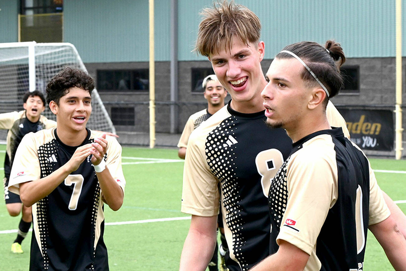Rick Ross/Peninsula College Athletics
Peninsula's Pau Vivas, right, is congratulated by teammates Angel Sandoval and Julius Koelle after scoring one of his three goals during the Pirates' 7-0 win over Portland.