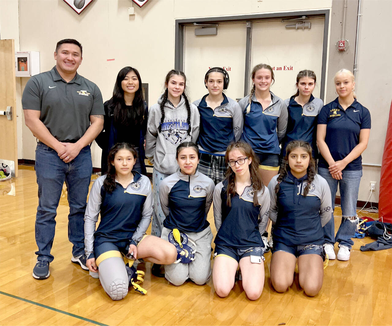 The Forks girls wrestling team finished second at The Prairie Open this weekend, beaten only by Yelm, a 4A school. From left, back row, are coach James Salazar, manager Moli Luong, Kinley Rondeau, Jade Blair, Riley Tjepkema, Alexis Koskela and Natalie Horejsi. From left, bottow row, are LaRayne Blair, Lilly Galeana, Flora Horejsi and Viviana Luna. (Forks High School)