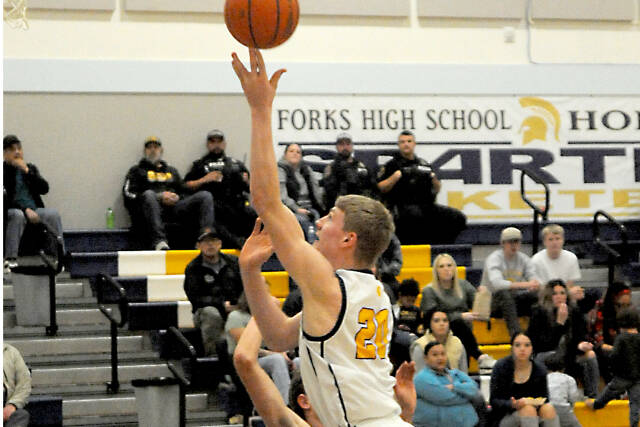 Forks Titus Rowley goes up for a basket against Coupeville on Monday night in Forks. The Spartans won 55-47. (Lonnie Archibald/for Peninsula Daily News)