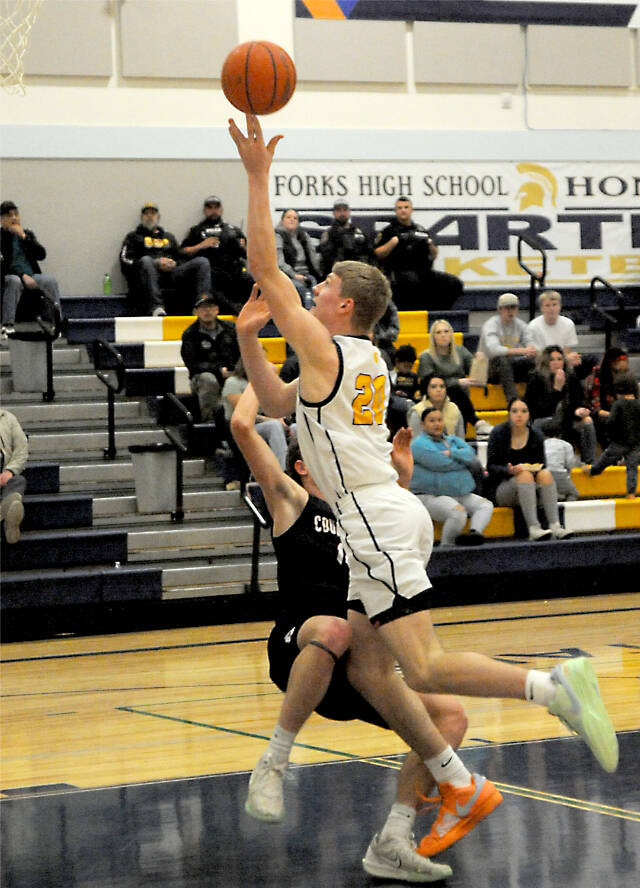 Forks Titus Rowley goes up for a basket against Coupeville on Monday night in Forks. The Spartans won 55-47. (Lonnie Archibald/for Peninsula Daily News)