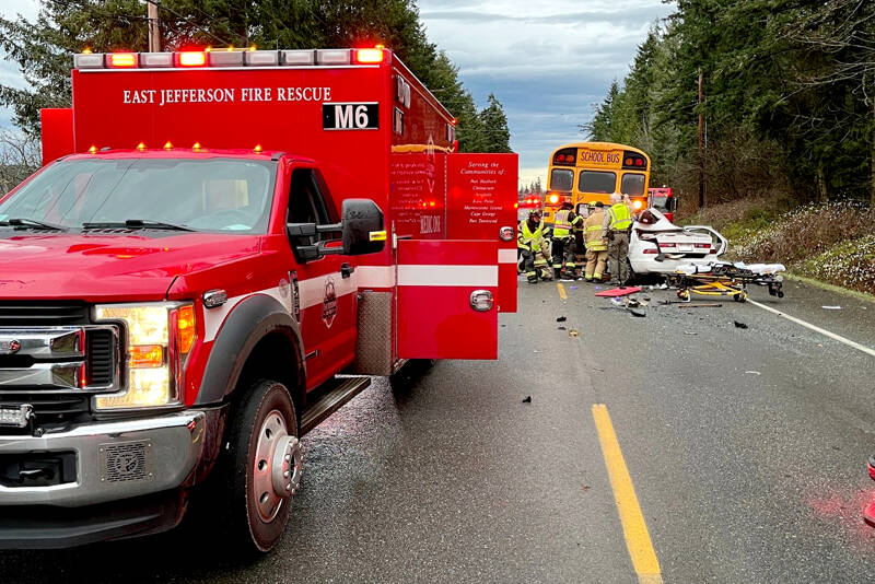 A 40-year-old Quilcene man died and a 7-year-old boy was airlifted to a Seattle hospital after the car in which they were riding collided with the back of a school bus on Center Road on Friday morning. (East Jefferson Fire Rescue)