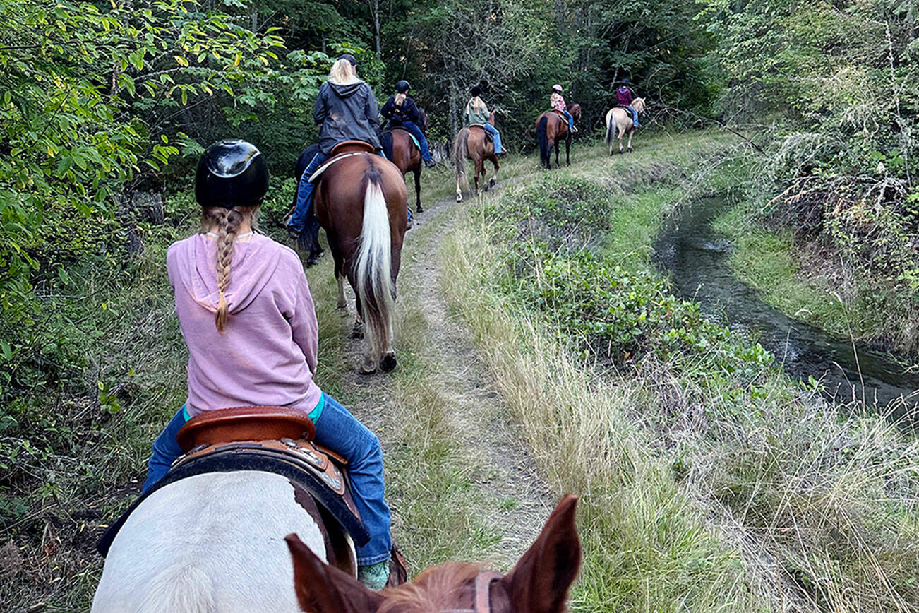(This photo for online please)
Cutline: After a group lesson in Leader Katie Salmon’s horse area, members of Neon Riders 4-H club enjoyed an end-of-summer ride through Dungeness Trails, which has more than 10 miles of trails, and is located off River Road in Sequim.