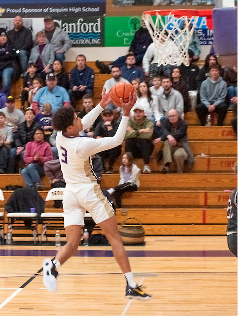 Sequim’s Solomon Sheppard goes up for a basket against W.F. West on Saturday. Sheppard had 11 points, two slam dunks, a 3-pointer and a blocked shot all in the first quarter, as the Wolves won to improve to 6-0. (Emily Matthiessen/Olympic Peninsula News Group)