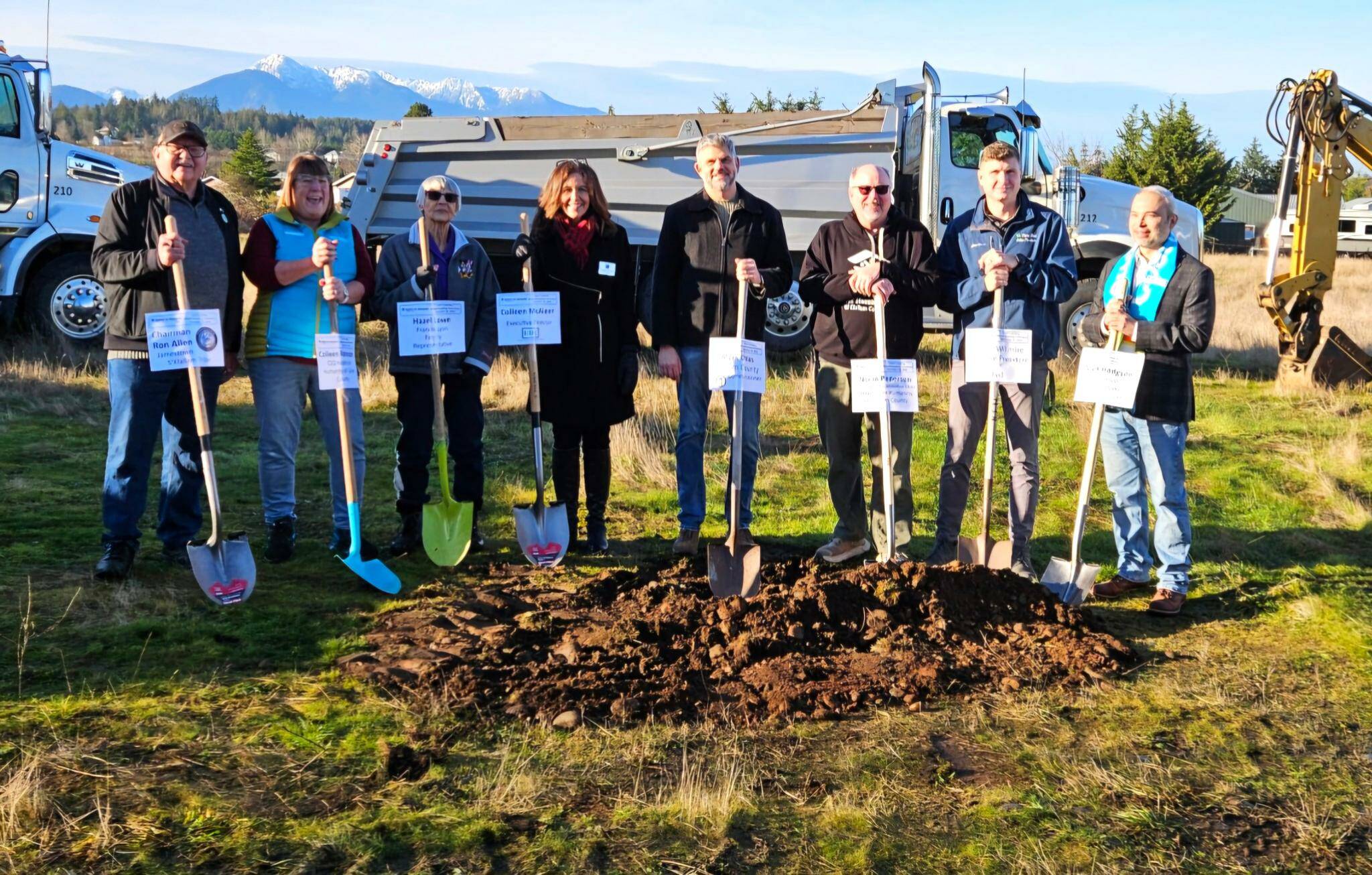 Stakeholders and community leaders stand together for the ceremonial groundbreaking of Habitat for Humanity of Clallam County’s Lyon’s Landing property in Carlsborg on Dec. 23. (Habitat for Humanity of Clallam County)