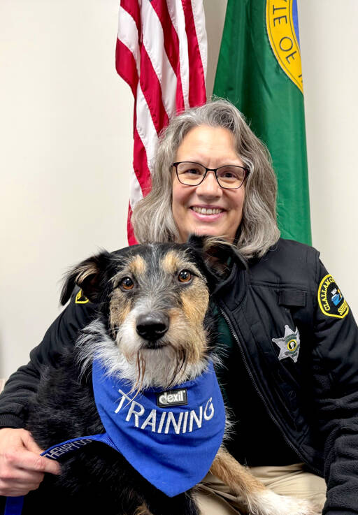 Chaplain Kathi Gregoire poses with Scout, her 4-year-old mixed breed dog. Scout is training to be a therapy dog to join Gregoire on future community calls with either the Clallam County Sheriff’s Office or the Washington State Patrol. (Clallam County Sheriff’s Office)