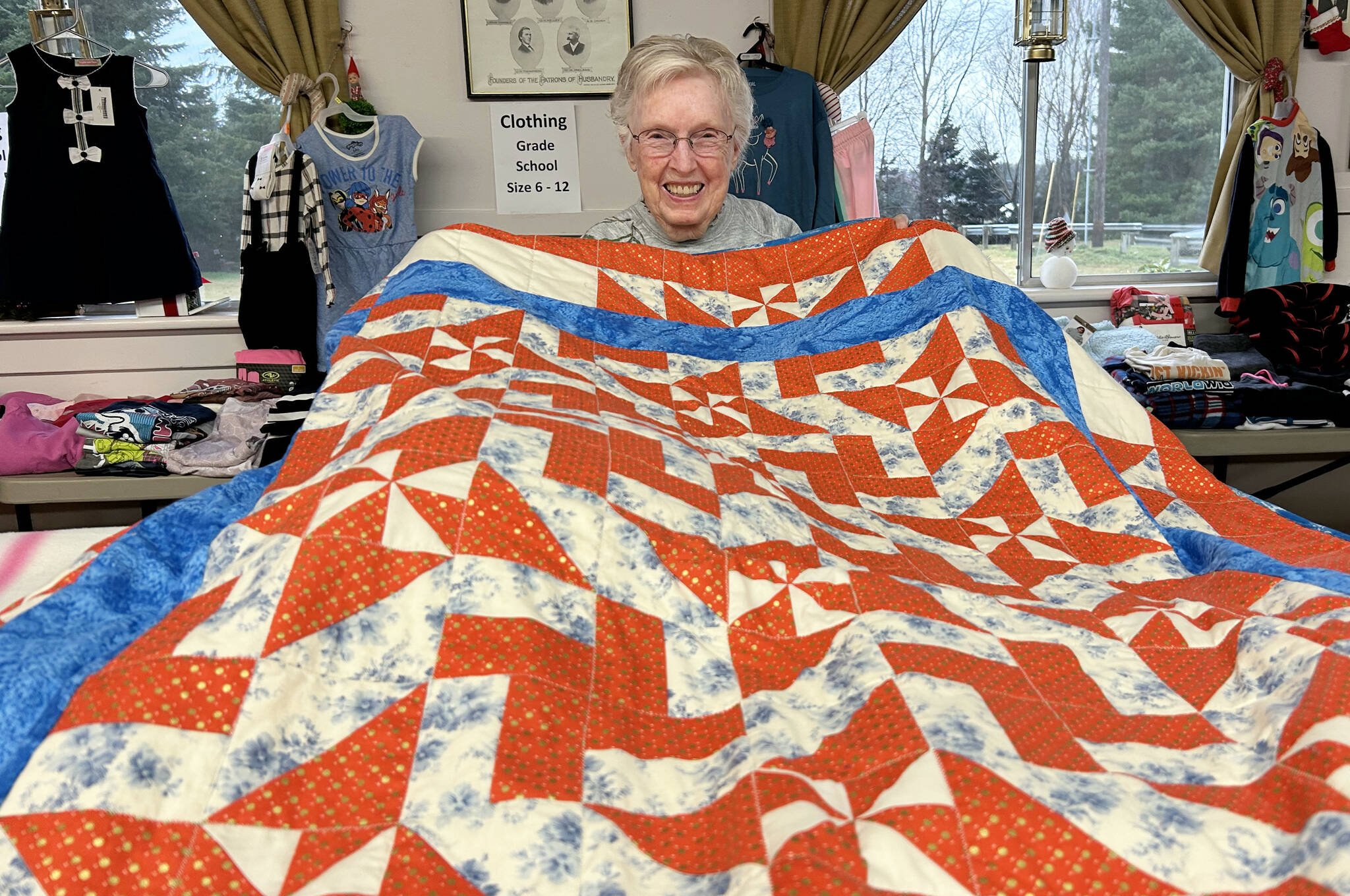 Matthew Nash/Olympic Peninsula News Group
LaRue Robirts shows one of the quilts she made for Toys for Sequim Kids on Dec. 17 at Sequim Prairie Grange. By her count, she’s made and donated more than 1,400 quilts to community efforts.