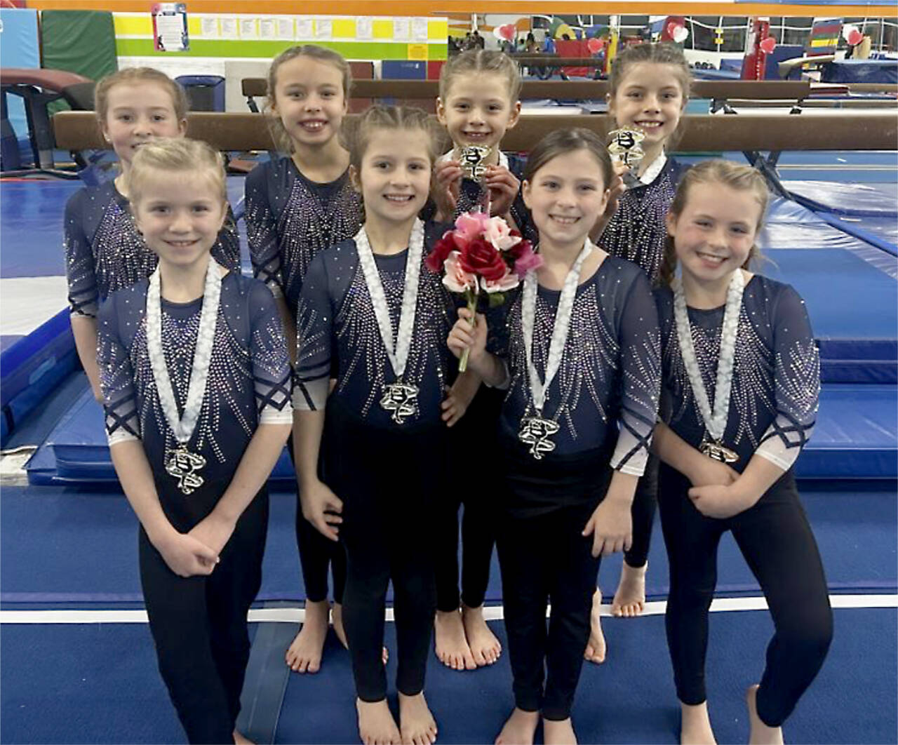 The Klahhane Xcel Bronze team finished first as a team at the Biggest Little Meet in Mukilteo on Sunday. From left, back row, are Penny Goodwin, Adrie McGuire, Lucy Monaghan and Kinley Matthews. From left, front row, are Sasha Gmazel, Nora Pecoraro, Addie Brown and Reagan Haguewood. (Klahhane Gymnastics)