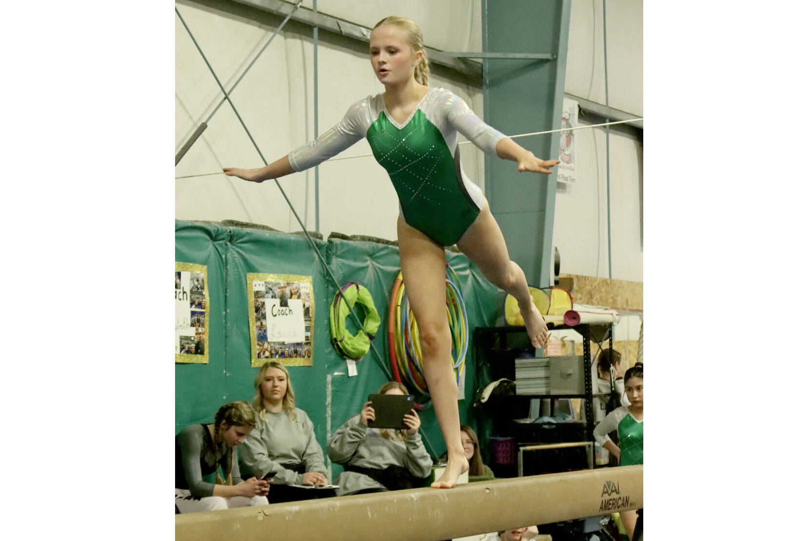 Port Angeles High School gymnast Mya Callis competes at the Port Angeles/Sequim home meet at the Klahhane Gymnastics center Monday. Bainbridge won the meet, while North Kitsap took second as the Spartans and Vikings are the top two gymnastics teams in the Olympic League. The combined Port Angeles/Sequim team took third. Lucy Spelker of the PA/Sequim team finished third in the floor exercie. Here, Port Angeles'  Mya Callis competes on the beam. The sub-district meet will be held Feb. 6. (Dave Logan/for Peninsula Daily News)