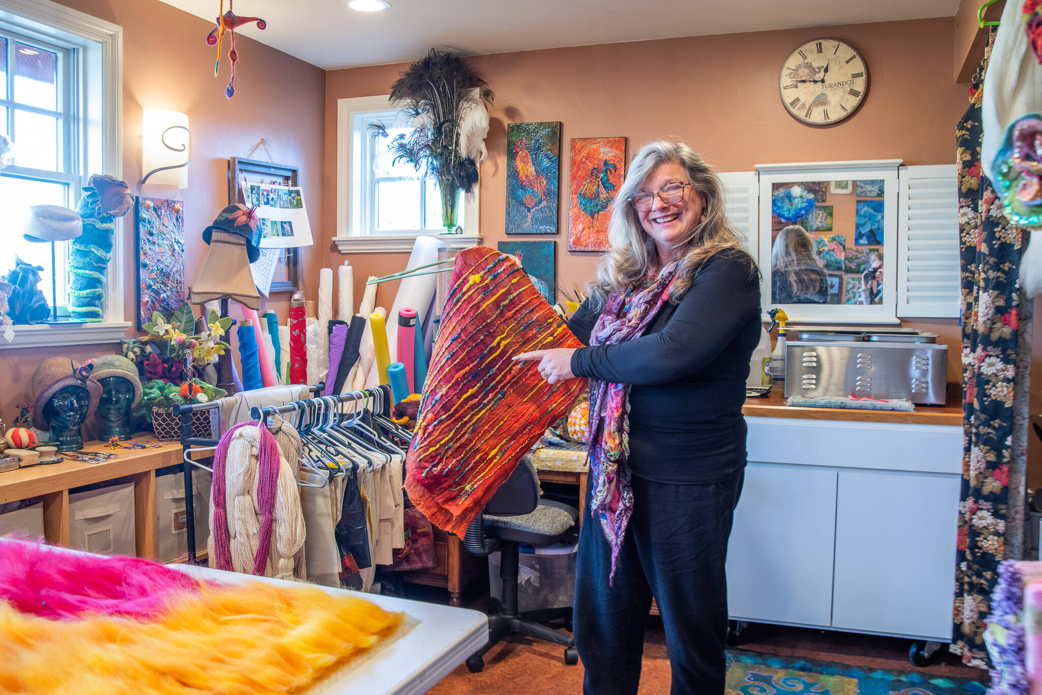 In her wet felting studio, Sequim artist Lora Armstrong explains how ruching happens in felt work. (Emily Matthiessen/Olympic Peninsula News Group)