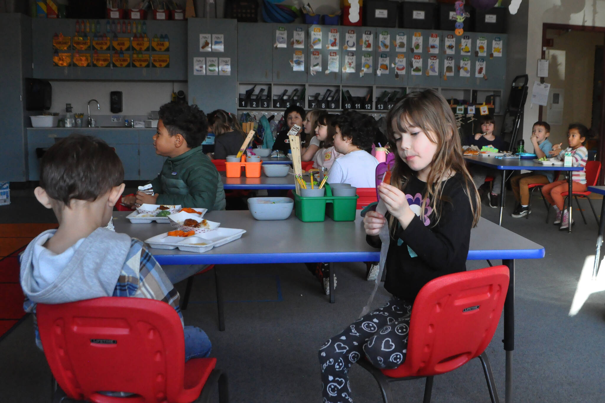 Kindergartener Zoey Griffin eats lunch with classmates in Amy Skogsberg’s class. For most of Greywolf Elementary’s history, students have eaten in their classrooms as the school was built without a dedicated cafeteria. A bond proposal includes building a cafeteria at the school, improving its parking lot and bus loop, and updating its air handler and heating units. (Matthew Nash/Olympic Peninsula News Group)