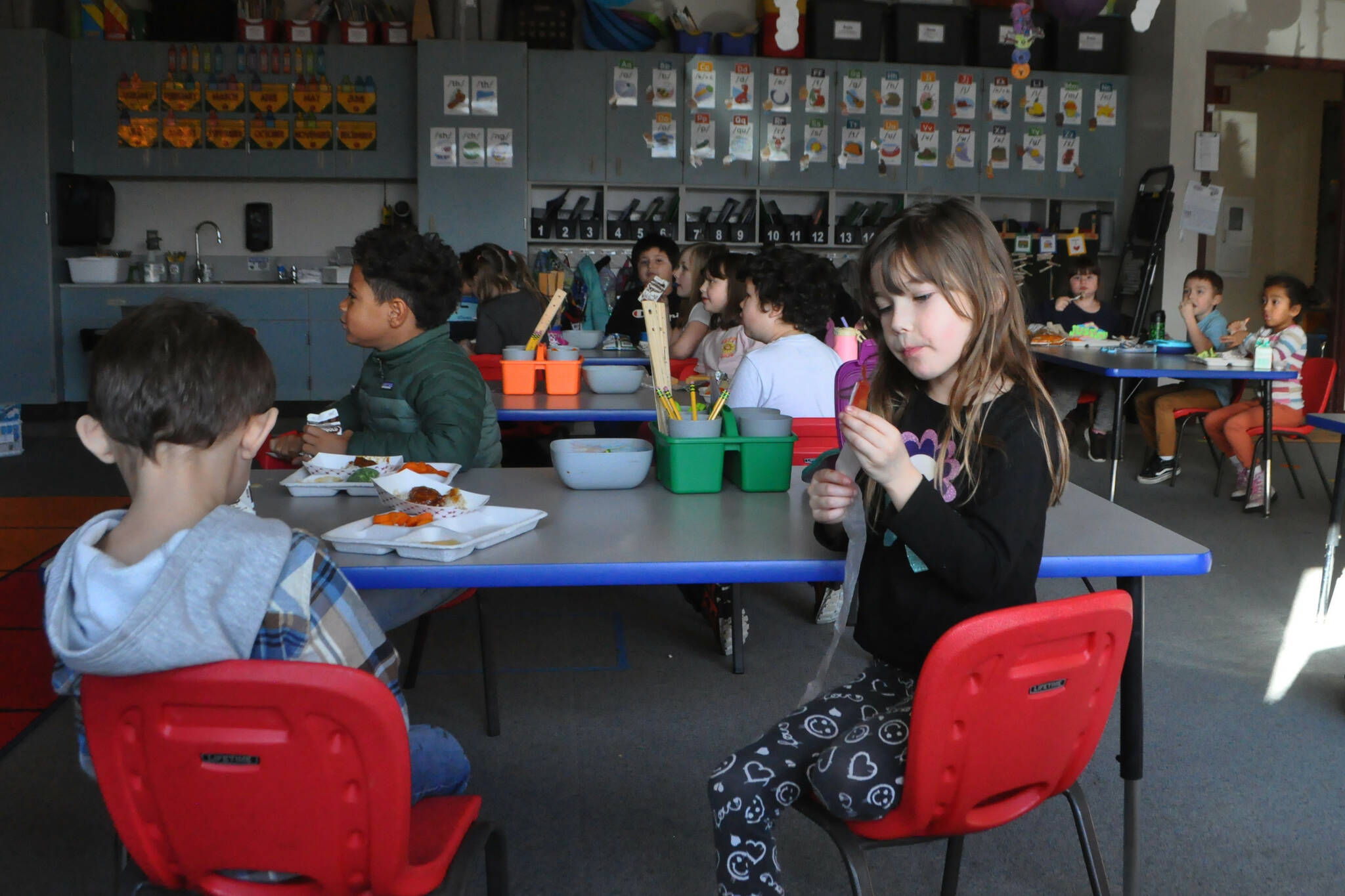 Kindergartener Zoey Griffin eats lunch with classmates in Amy Skogsberg’s class. For most of Greywolf Elementary’s history, students have eaten in their classrooms as the school was built without a dedicated cafeteria. A bond proposal includes building a cafeteria at the school, improving its parking lot and bus loop, and updating its air handler and heating units. (Matthew Nash/Olympic Peninsula News Group)