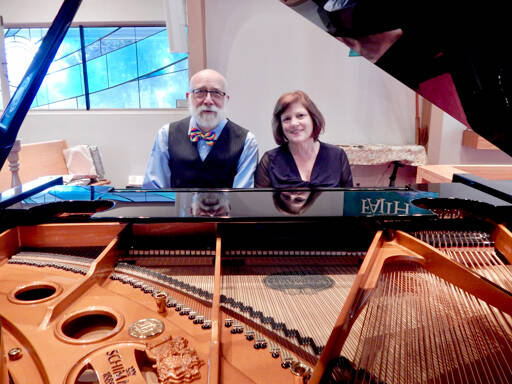 Michael Carroll, pianist and co-artistic director, and Lisa Lanza, pianist and a founding member of the Port Townsend Symphony Orchestra Chamber Music Series, take a break from practice. (Port Townsend Symphony Orchestra)