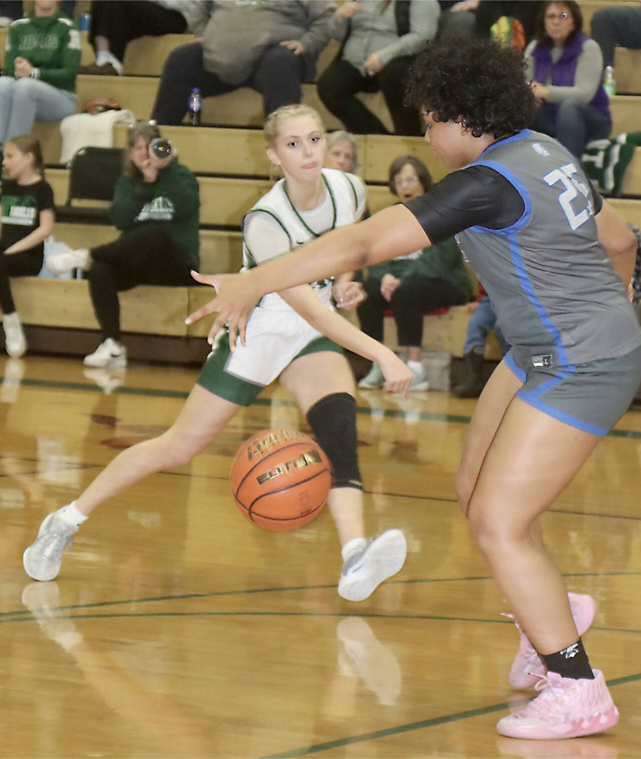 Port Angeles’ Teanna Clark passes the ball against Olympic on Friday night. The Roughriders girls pulled off the unusual feat of winning two games in one night. (Dave Logan/for Peninsula Daily News)