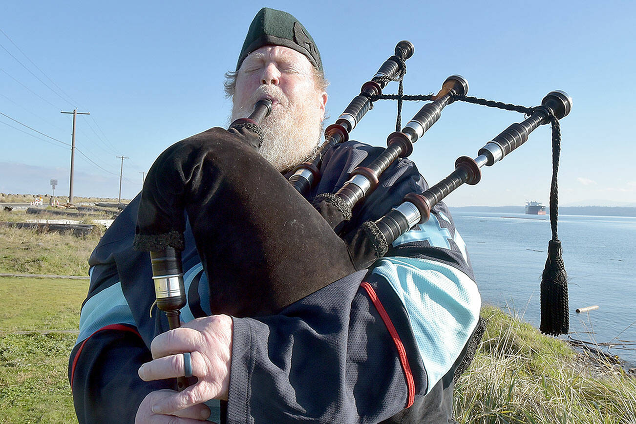 Erik Evans of Port Angeles, known as the “Parking Lot Piper,” performs on Tuesday at Sail and Paddle Park on Ediz Hook in Port Angeles. Evans often gives a free lunchtime concert on bagpipes at various locations in the Port Angeles area. (Keith Thorpe/Peninsula Daily News)