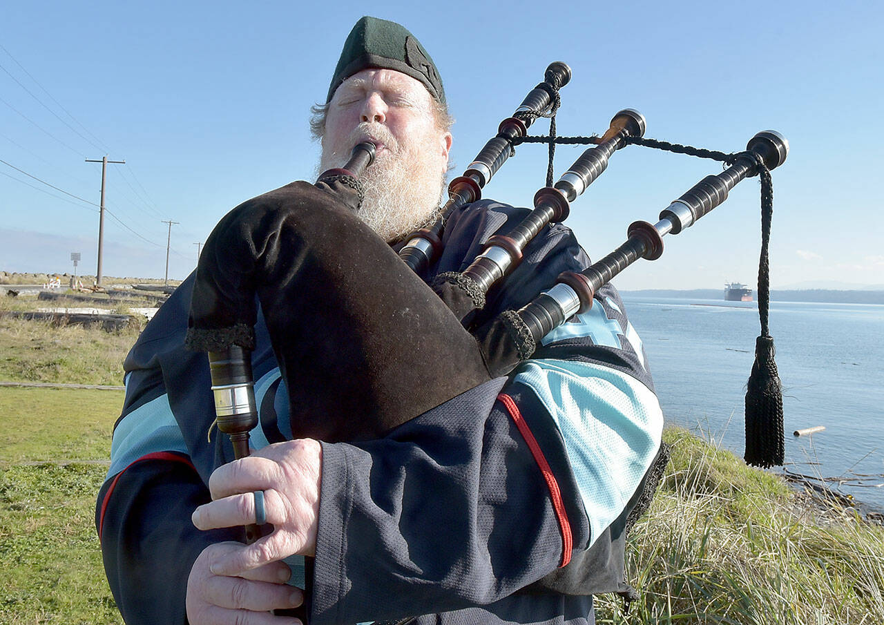 Erik Evans of Port Angeles, known as the “Parking Lot Piper,” performs on Tuesday at Sail and Paddle Park on Ediz Hook in Port Angeles. Evans often gives a free lunchtime concert on bagpipes at various locations in the Port Angeles area. (Keith Thorpe/Peninsula Daily News)