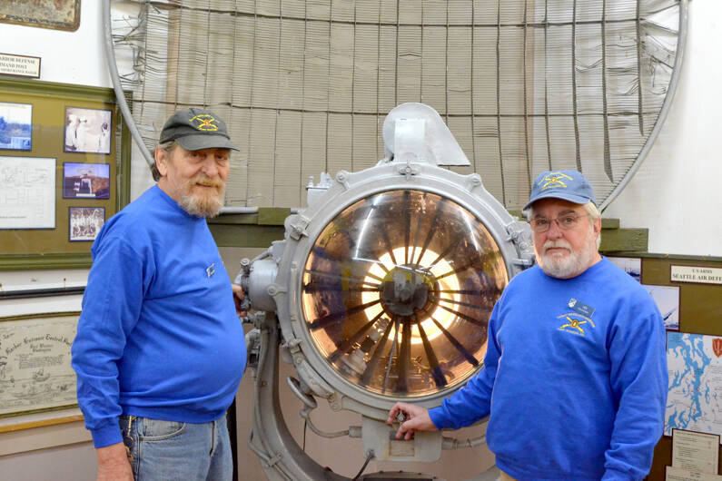 Coast Artillery Museum volunteers Ron Raplee, left, and Les Jones at the Coast Artillery Museum on Friday. (Elijah Sussman/Peninsula Daily News)