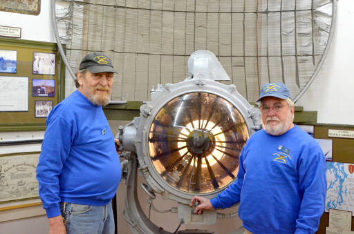 Coast Artillery Museum volunteers Ron Raplee, left, and Les Jones at the Coast Artillery Museum on Friday. (Elijah Sussman/Peninsula Daily News)