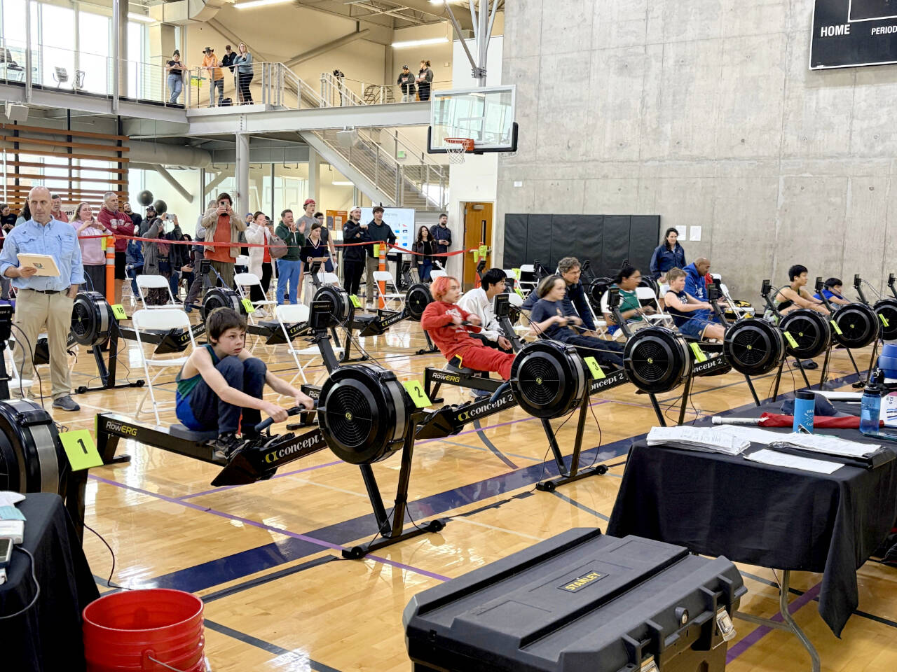 From left, Ryan Halfacre, Airius Ingle, Quince Chanway and Eagle Zuniga from the Olympic Peninsula Rowing Association compete in the under-15 men’s 500-meter race in Tacoma on Saturday. Under-17 competitor Mason Mai and OPRA head coach Sean Halberg look on. (Olympic Peninsula Rowing Association)