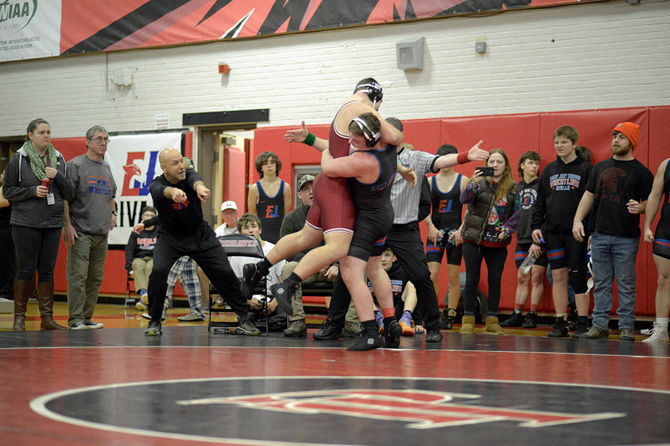 Mason Iverson, right, lifts Kingston's Jack Grady before earning a pin during East Jefferson's home tournament in December. Wrestling for the Port Townsend-based team, Iverson became the first Quilcene student to qualify for Mat Classic, the state wrestling meet, earlier this week.  