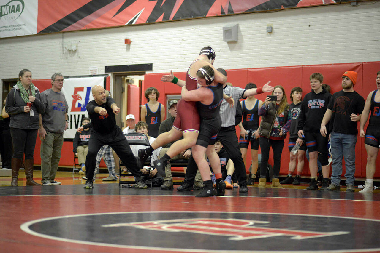 Mason Iverson, right, lifts Kingston’s Jack Grady before earning a pin during East Jefferson’s home tournament in December. Wrestling for the Port Townsend-based team, Iverson became the first Quilcene student to qualify for Mat Classic, the state wrestling meet, earlier this week.