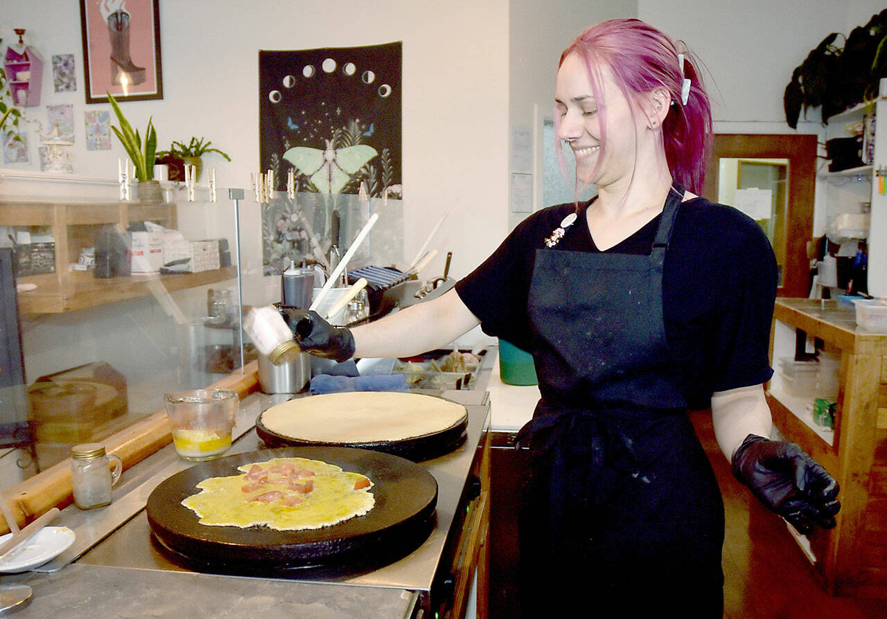 Shay Christensen, owner of the Pink Pony Café in downtown Port Angeles, creates a designer crepe. (Keith Thorpe/Peninsula Daily News)