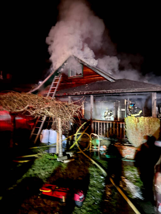 Firefighters respond to a house fire at West Sixth Street and Cherry Street on Friday in Port Angeles. (Port Angeles Fire Department)