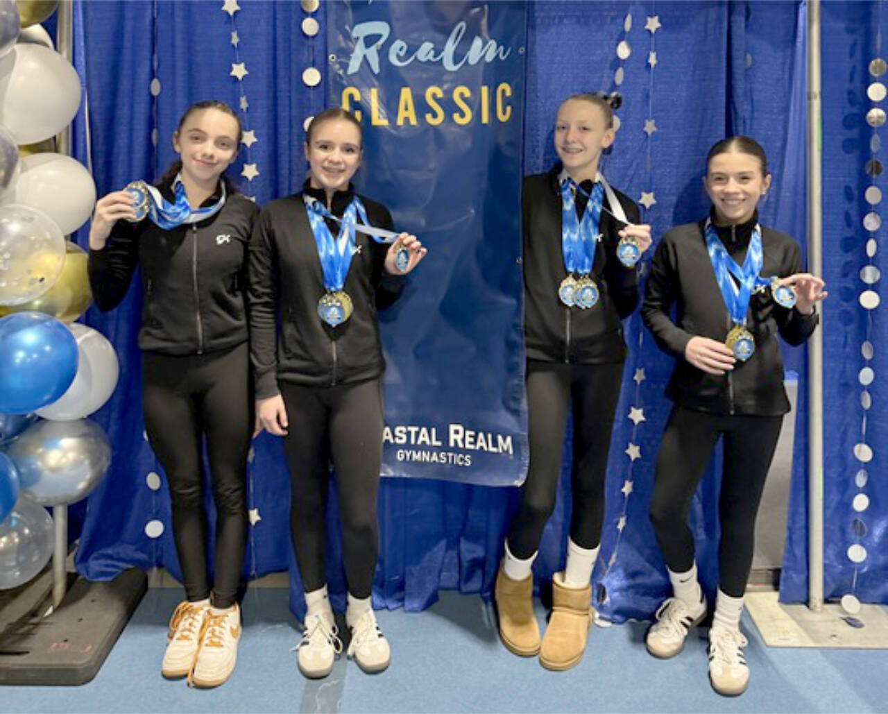 The Klahhane Xcel Gold team from left, includes Lainey DePiro, Raynee Ciarlo, Lorelei Sanders and Emily Bair. Four out of the six Xcel Gold members got 9.0 or higher in the floor exercise at the Realm Classic meet in Everett this weekend. (Klahhane Gymnastics)s)