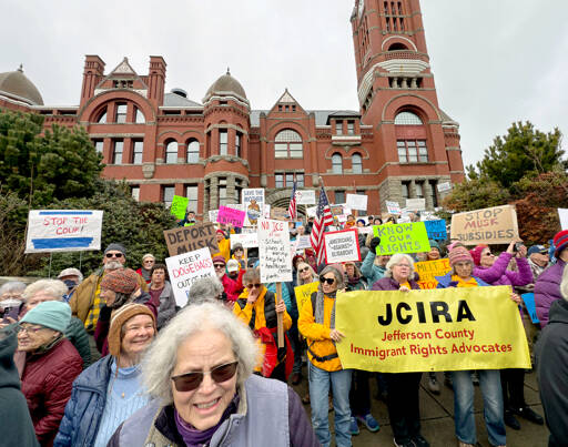 About 800 people from Jefferson and Clallam counties spill out from the steps of the Jefferson County Courthouse onto Jefferson Street in Port Townsend on Monday to take part in a National Day of Protest organized by the 50501 Movement, which stands for “50 protests, 50 states, 1 movement.” (Steve Mullensky/for Peninsula Daily News)