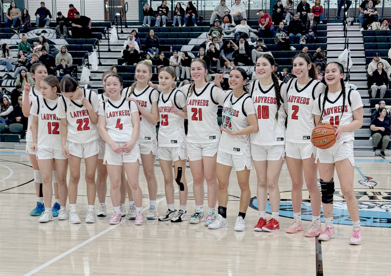Neah Bay Red Devils 
The Neah Bay Red Devils celebrate their Tri-District tournament championship Saturday night in Auburn. Neah Bay goes to state looking to win its third straight state championship. From left, are, Cerise Moss, Kandi McGimpsey (12), Destiny Lawrence (22), Brianna McGimpsey (4), Trinity Johnson, Danica Halttunen (13), Wiinuk Martin (21), Qwaapeys Greene (15), Lillie Yallup (10), Angel Halttunen (2) and Caylee Moss (11). Obscured is Tisalee Ramos.