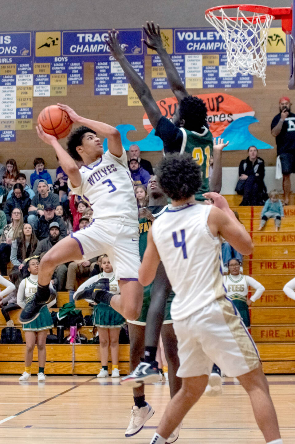 Sequim’s Solomon Sheppard goes up for a basket last week in a District 3 tournament game in Sequim against Foss. Sheppard had 14 points in a 56-46 win over Port Angeles on Saturday to help send the Wolves to the state tournament for the first time since 2012. In the foreground is Jericho Julmist (4). (Emily Mathiessen/Olympic Peninsula News Group)